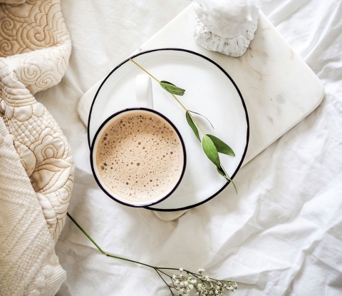 Latté, flowers and a quilt