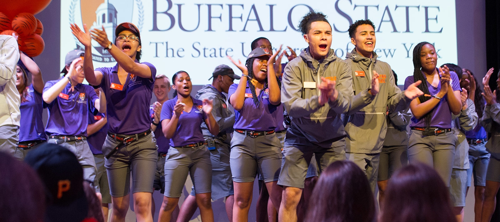 Orientation leaders perform on stage